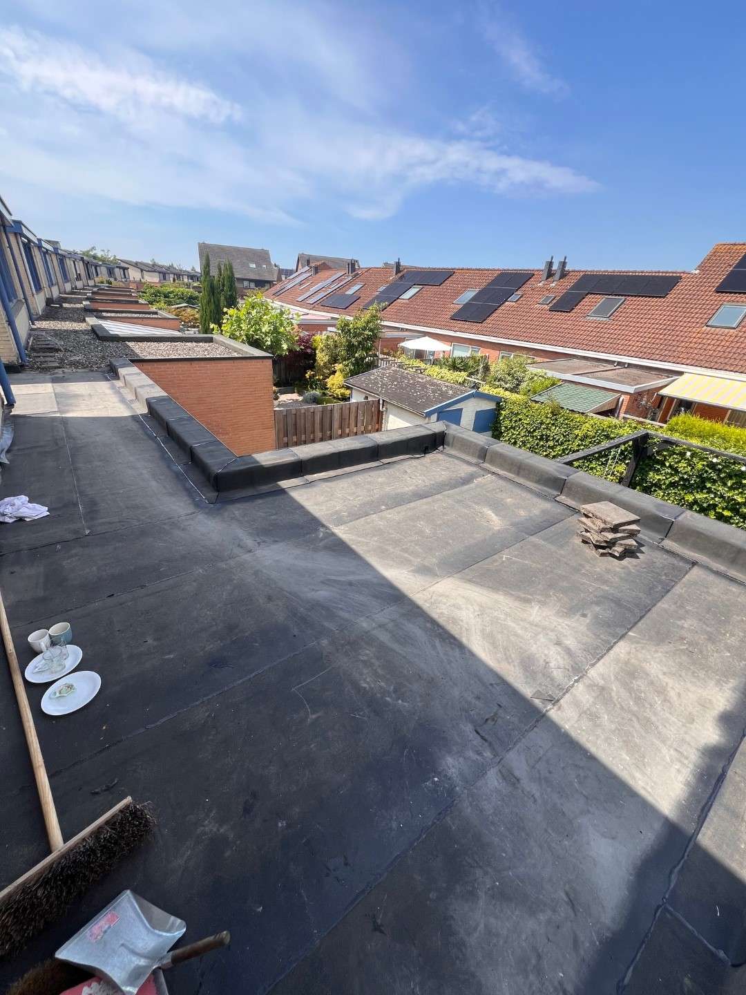 Dakpannen vervangen en plat dak repareren